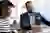 Image - two people discussing business on laptop